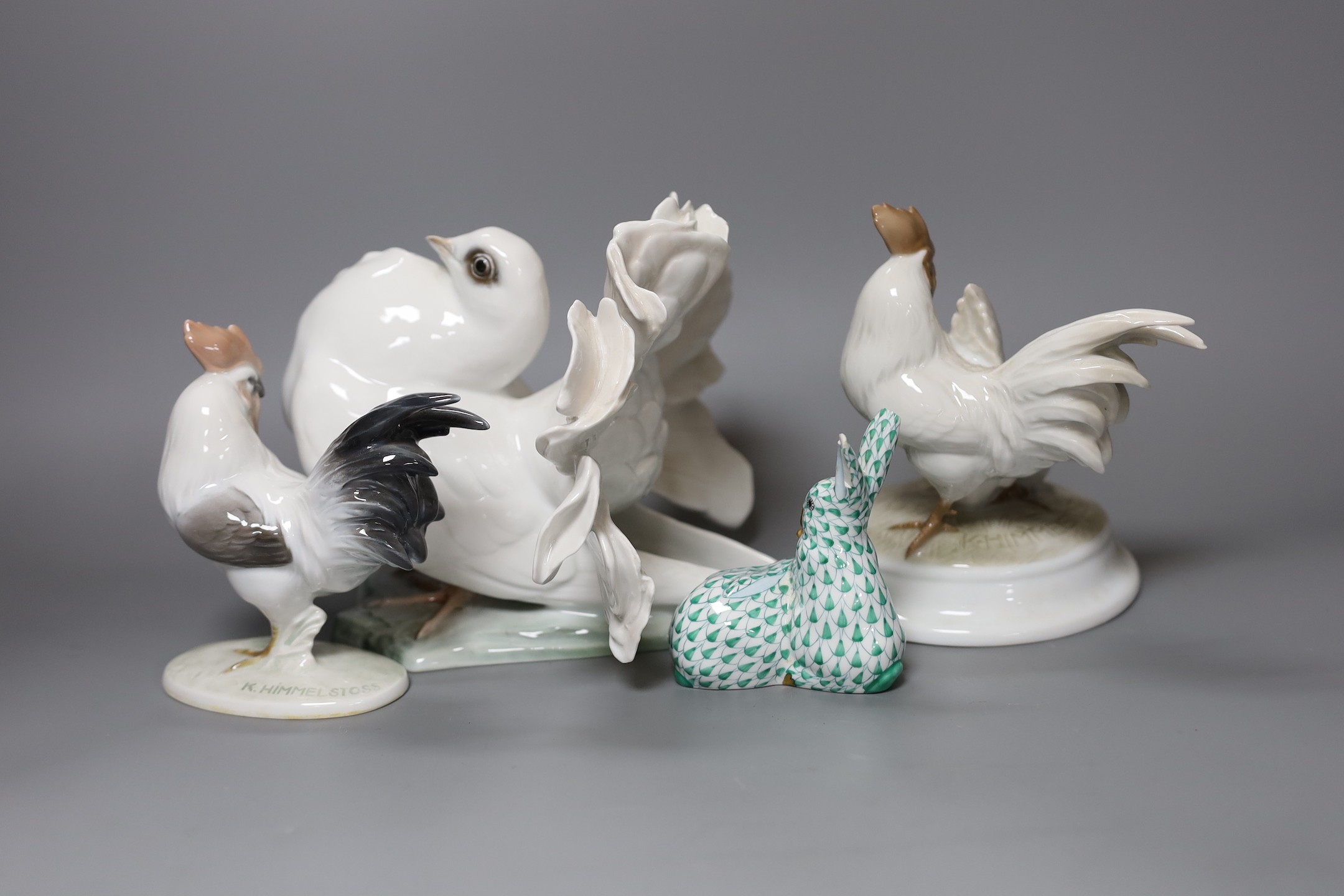 A Herend model of a rabbit, a pair of Rosenthal porcelain models of cockerels and a porcelain pigeon, tallest 15cm, (4)